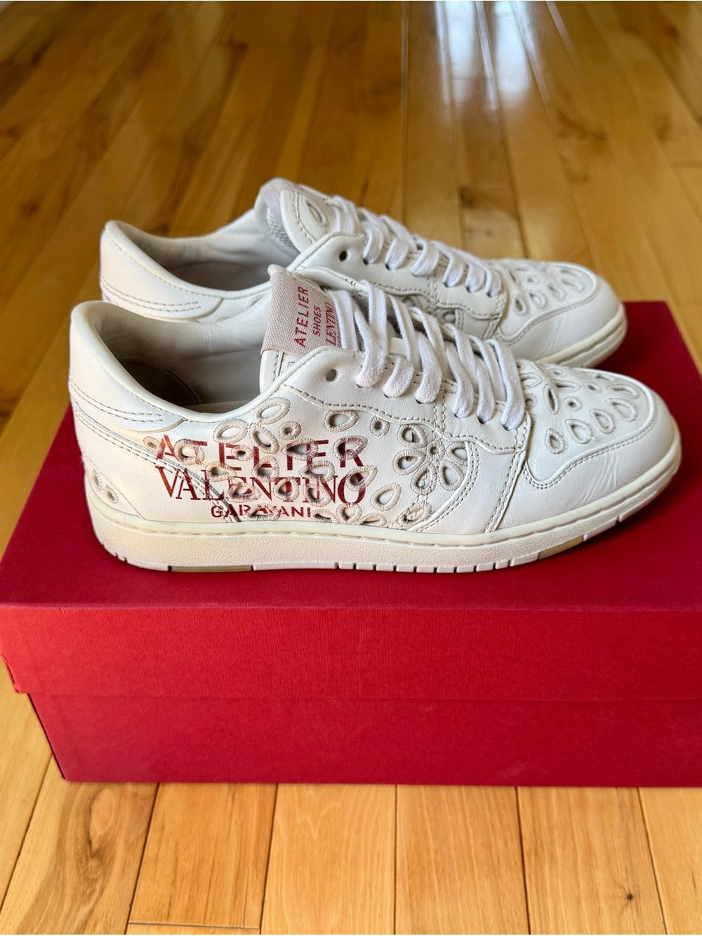 Valentino Garavani Off-White Leather Sneakers with Red Logo